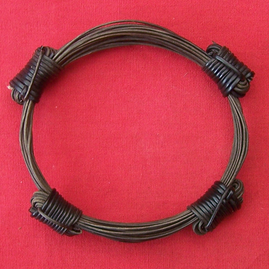 Very unique composition of 4 black elephant hair knots atop fourteen strands of the finest quality brown elephant hair which form the bracelet's girth. - BB9