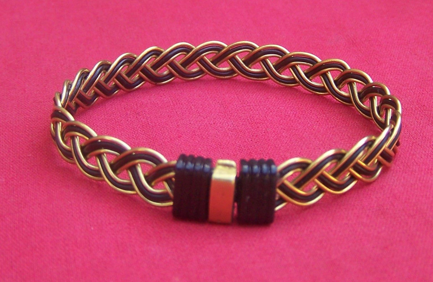 Very unique design. Black elephant hair and brass wire woven bracelet. Brass on black clasp. Lovely contrast. - JE5R