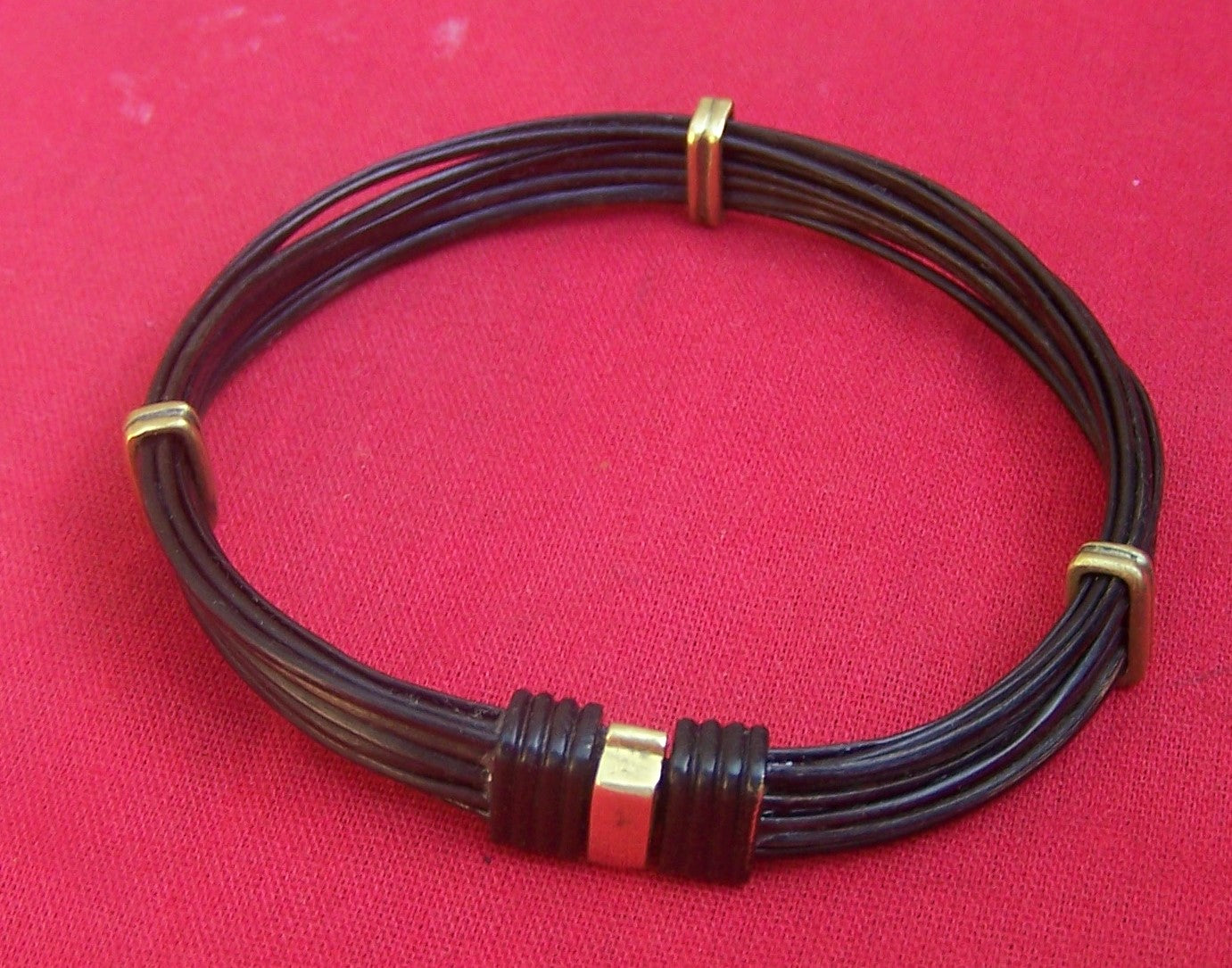 Plain dark elephant hair bracelet with brass on black "click to close" clasp and brass sliders. - JEJX