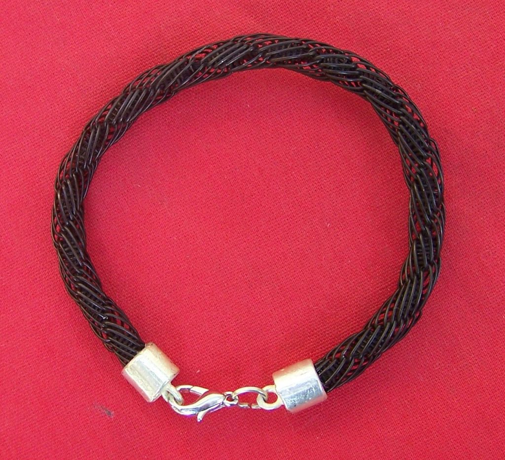 An intricately woven design of fine black elephant hairs. Stunning on any lady's wrist! - JEG4