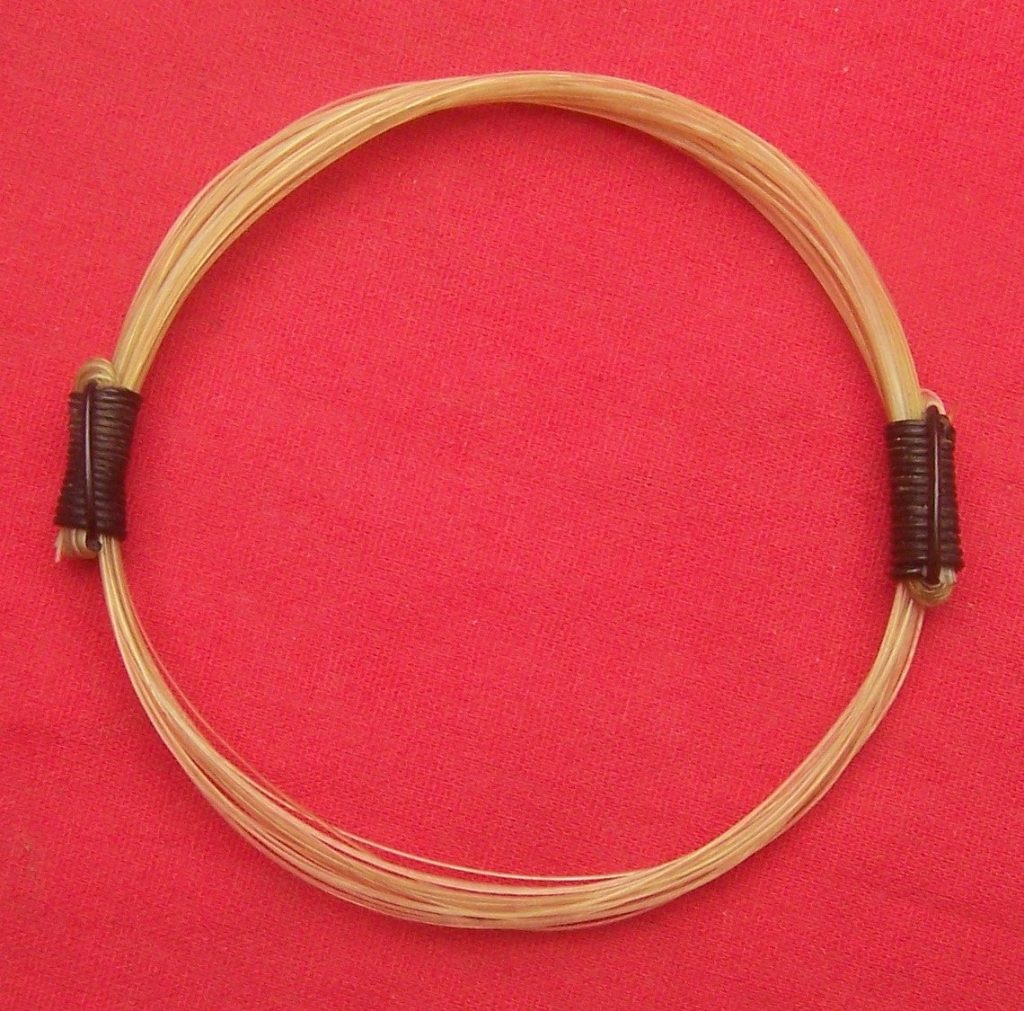 "Purest White" giraffe hair bracelet, tied fashionably with 2 dark elephant hair knots. Maybe this bracelet will bring you luck from the giraffe and the elephant, but maybe it won't. Order yours today and let me know if it is your lucky bracelet. - JEGR4