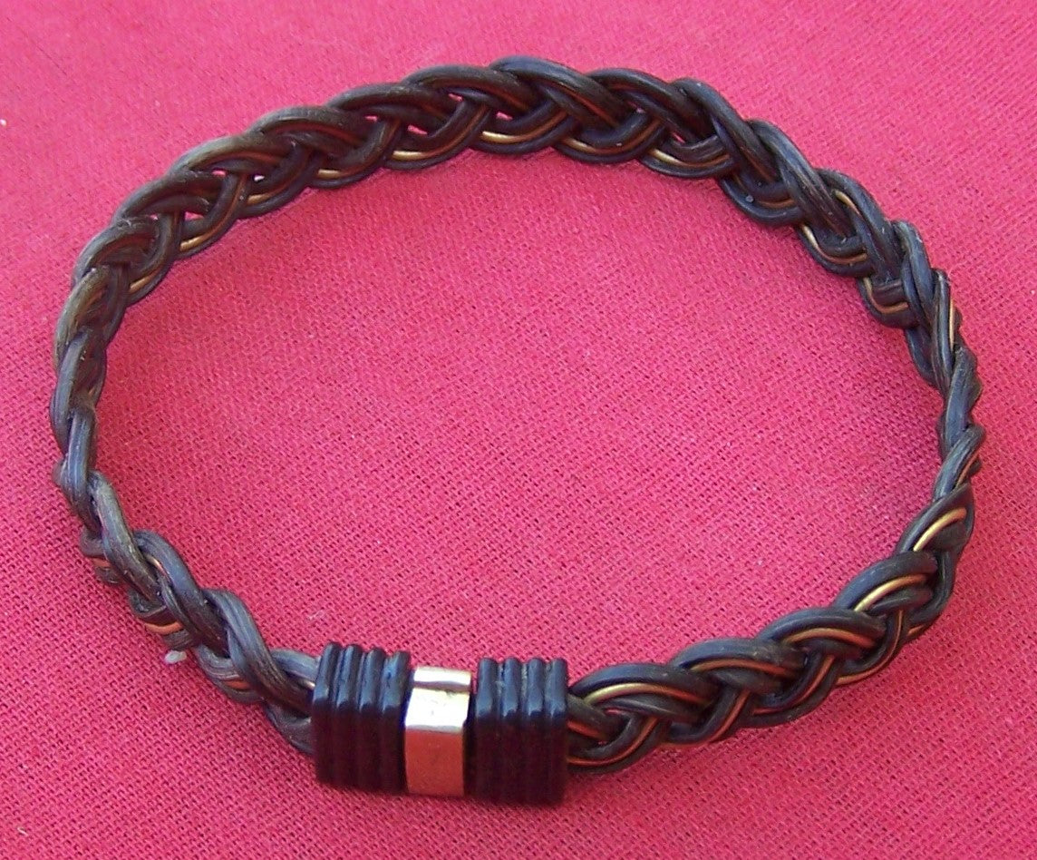 Class and style emanate from the dark elephant hair and brass filament weave of the JELB.