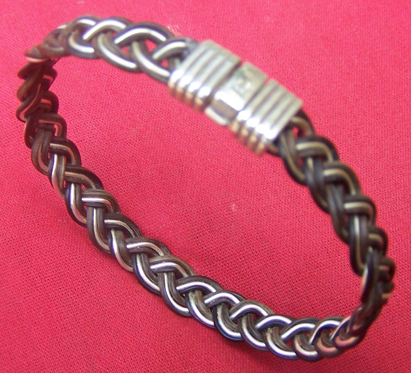 Class and style emanate from the dark elephant hair and sterling silver filament weave of the JEPP.