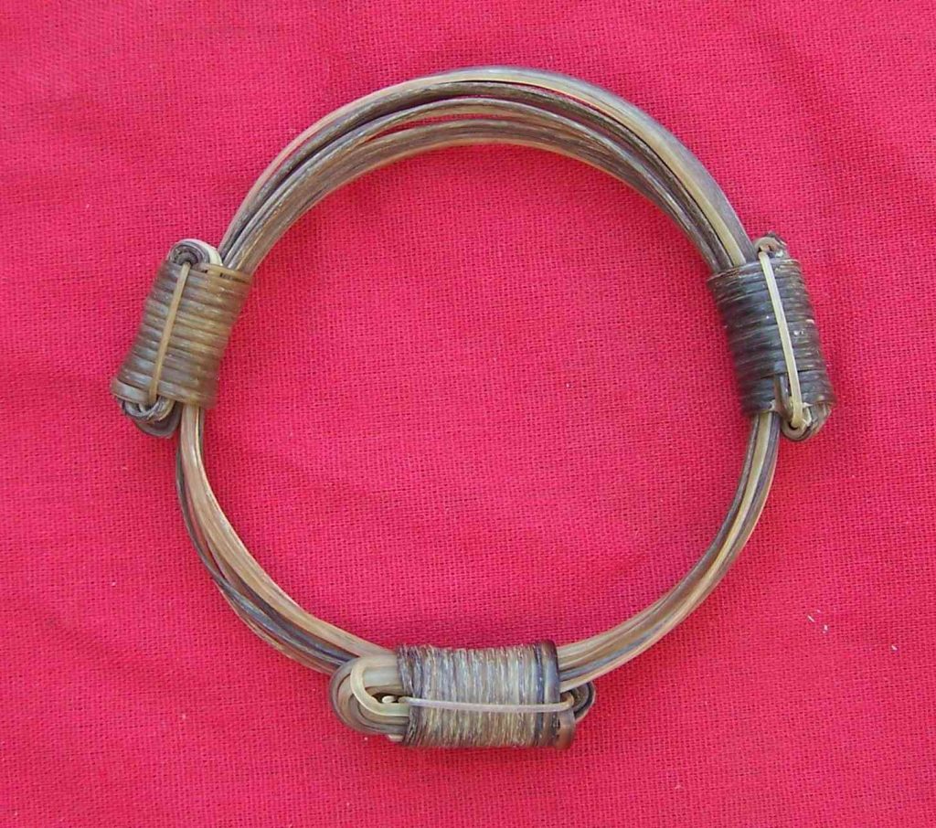 9 strands or only white elephant hair are held together with triple knots. The white elephant hairs have the lightest brown highlights. Stylish edition of the White Elephant Hair Bracelets Collection. - JEW3