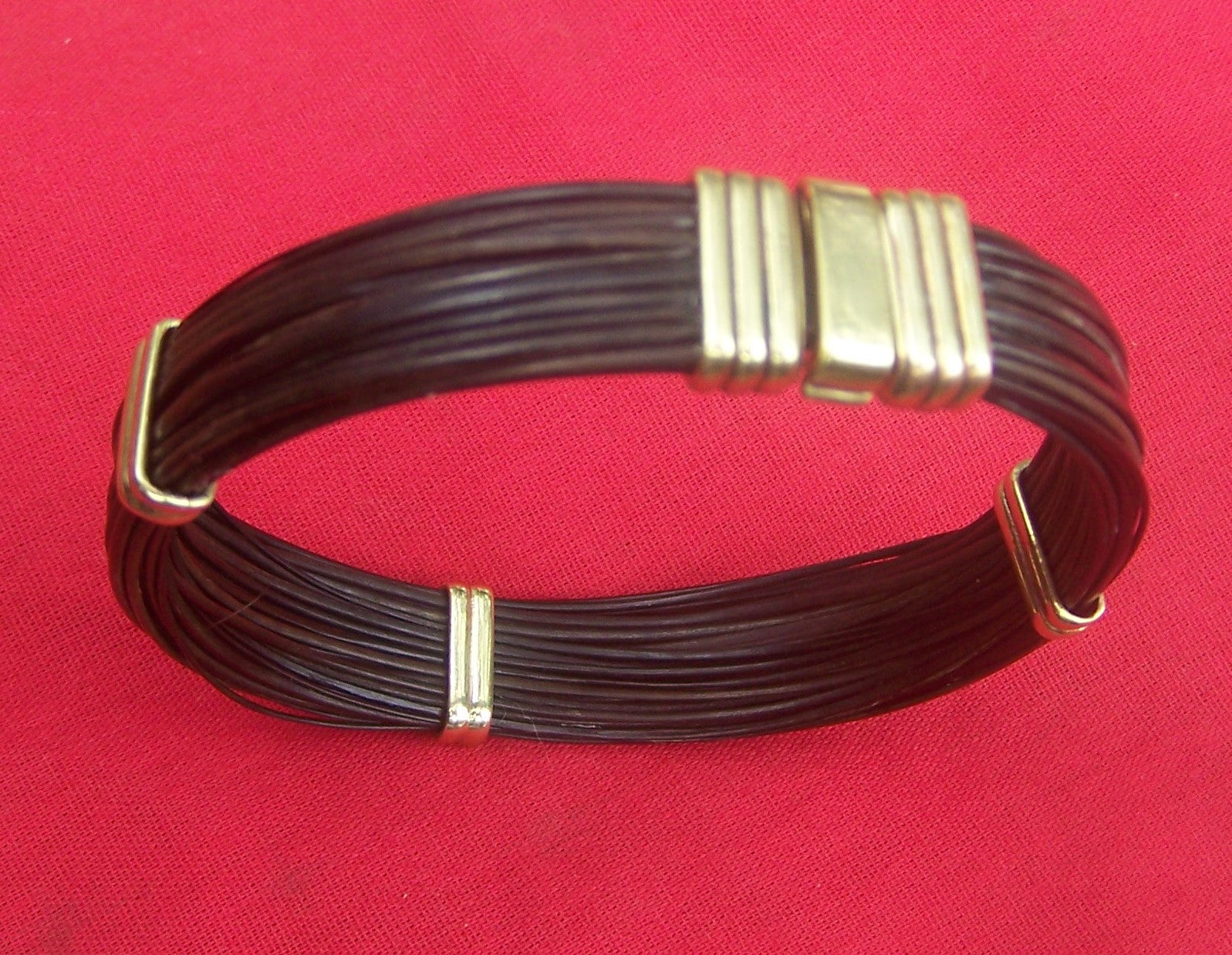 Earthy golden brass makes for a warmer tone in this elephant hair bracelet. - JJ86