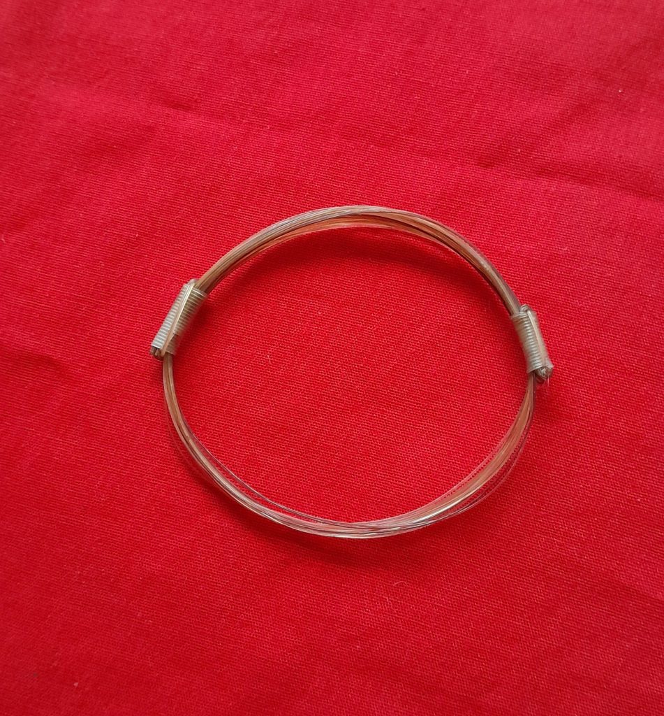 GIR16 Genuine off white giraffe hair bracelet with white knots.