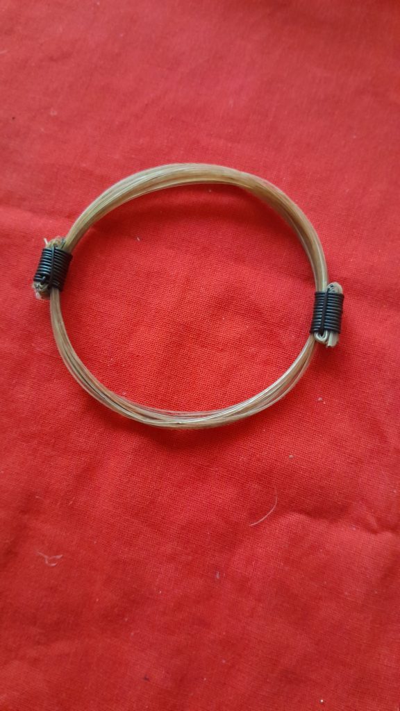 GIR12 Genuine white giraffe hair bracelet with elephant hair knots.